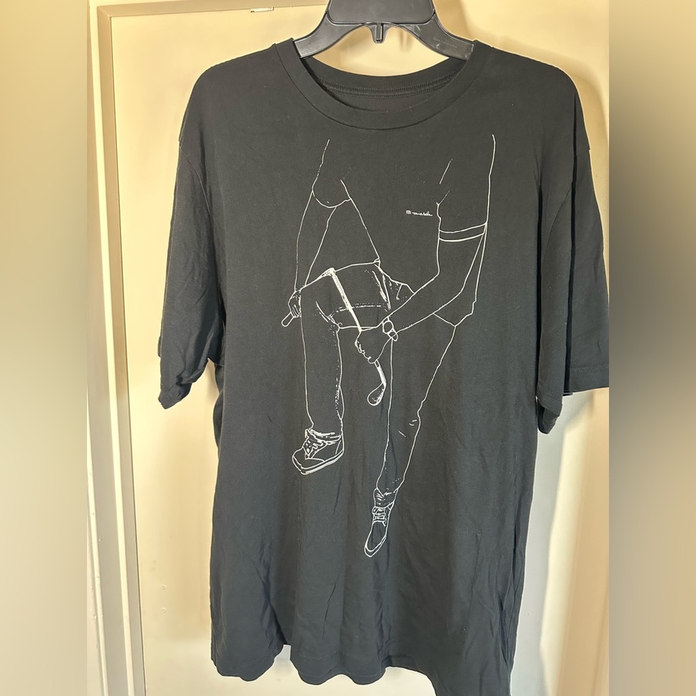 Travis Mathew Black Tee with Line Art Design